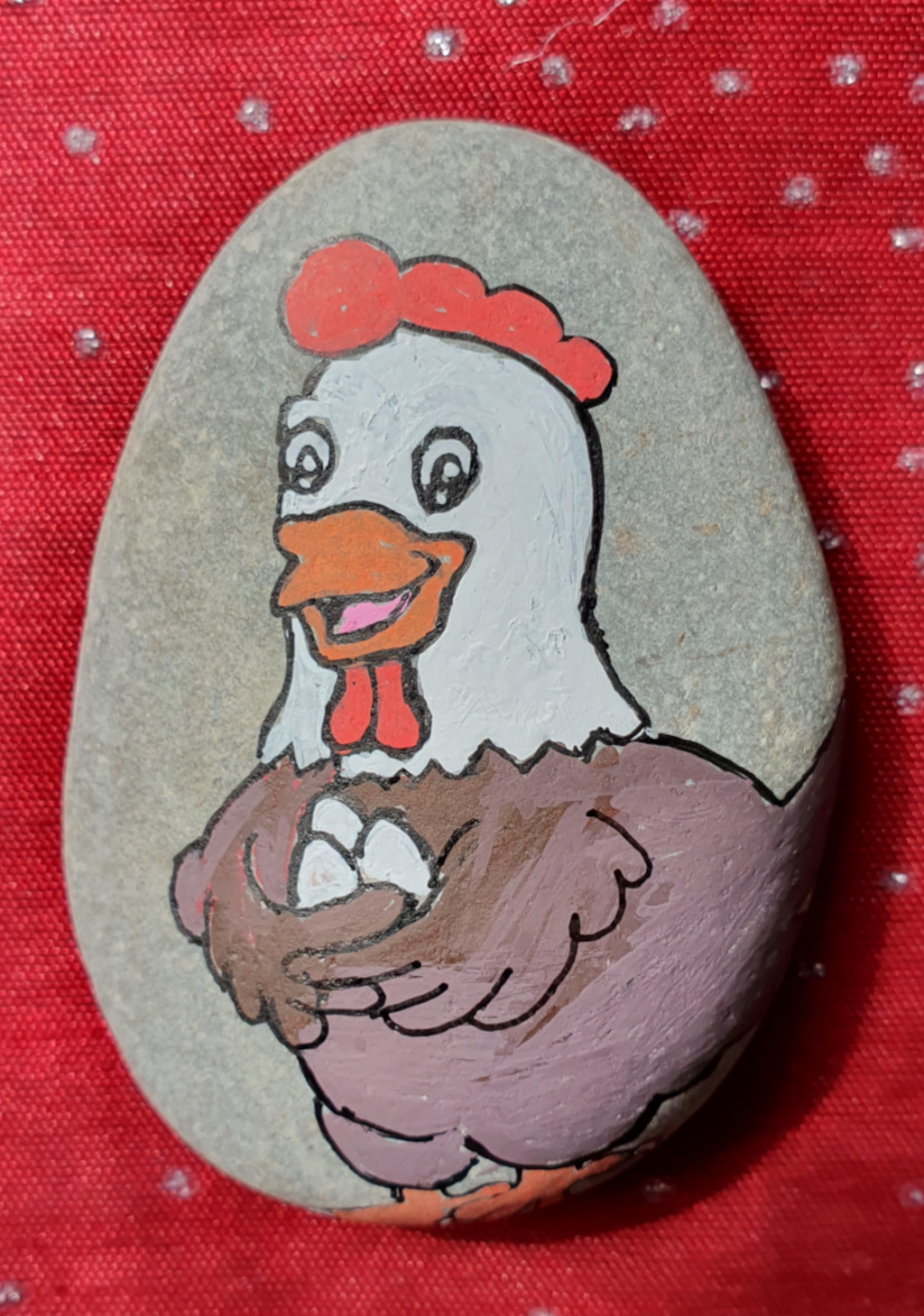 Easter Happy chicken on rock : 1649745625.poule.heureuse.png